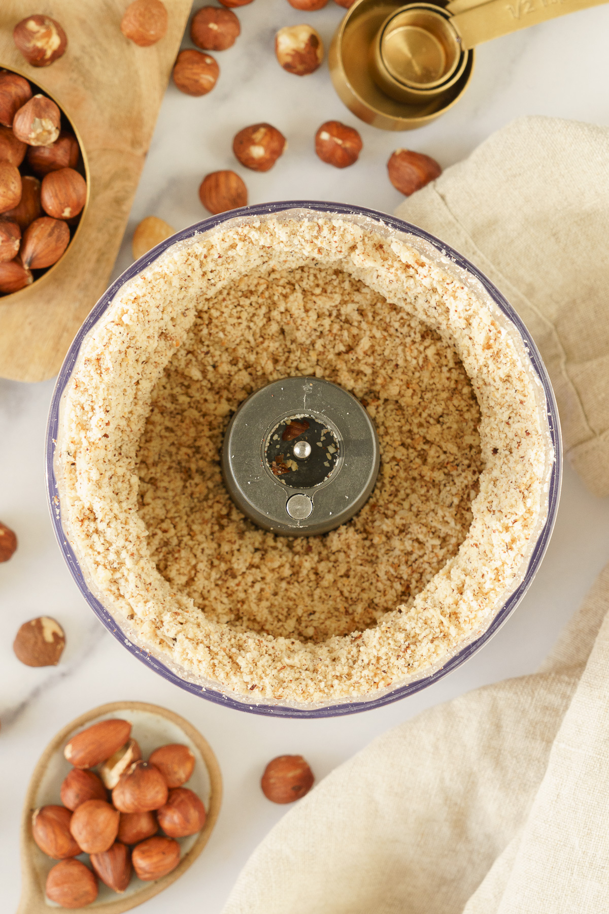 Ground hazelnuts in a food processor.