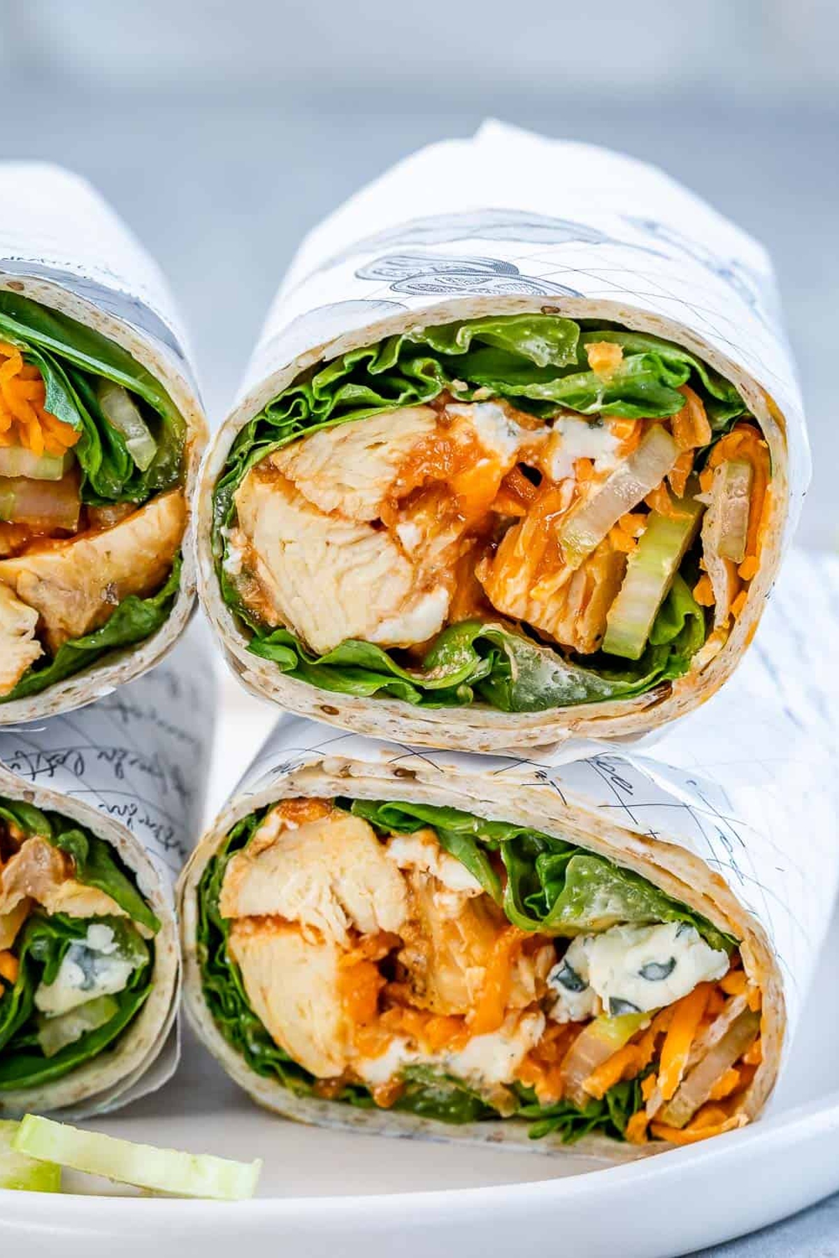 A pile of buffalo grilled chicken wraps.