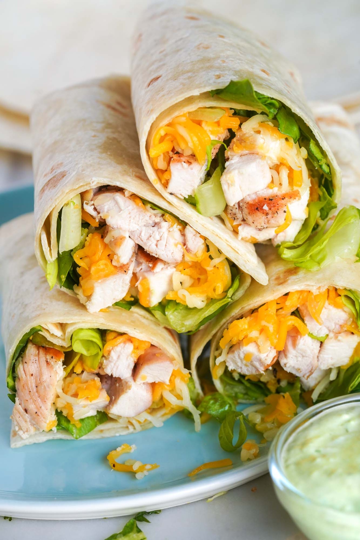  A stack pile of chick-fil-a cool wrap copycat with dressing.
