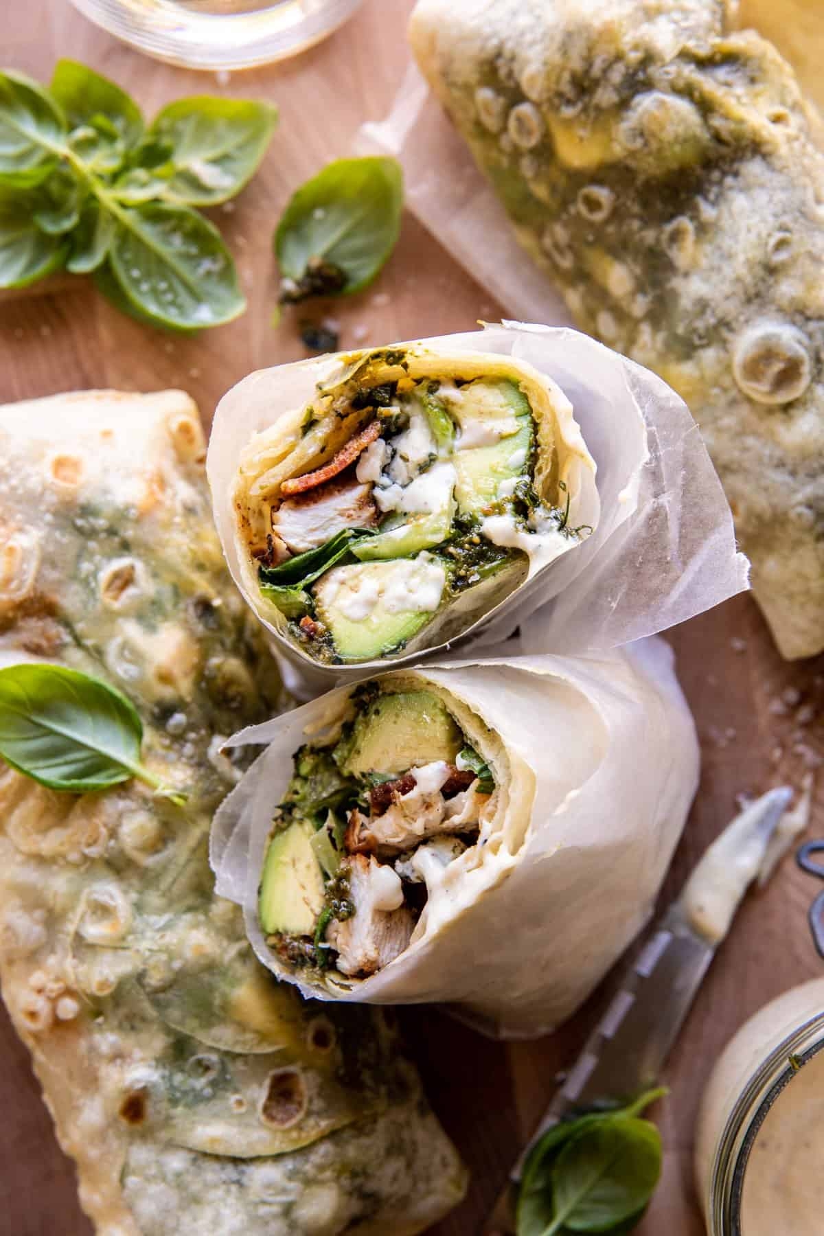 Pesto chicken and avocado bacon salad wraps.