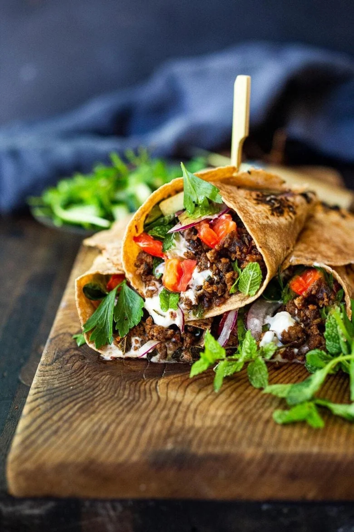 Turkish lamb wraps on a cutting board.