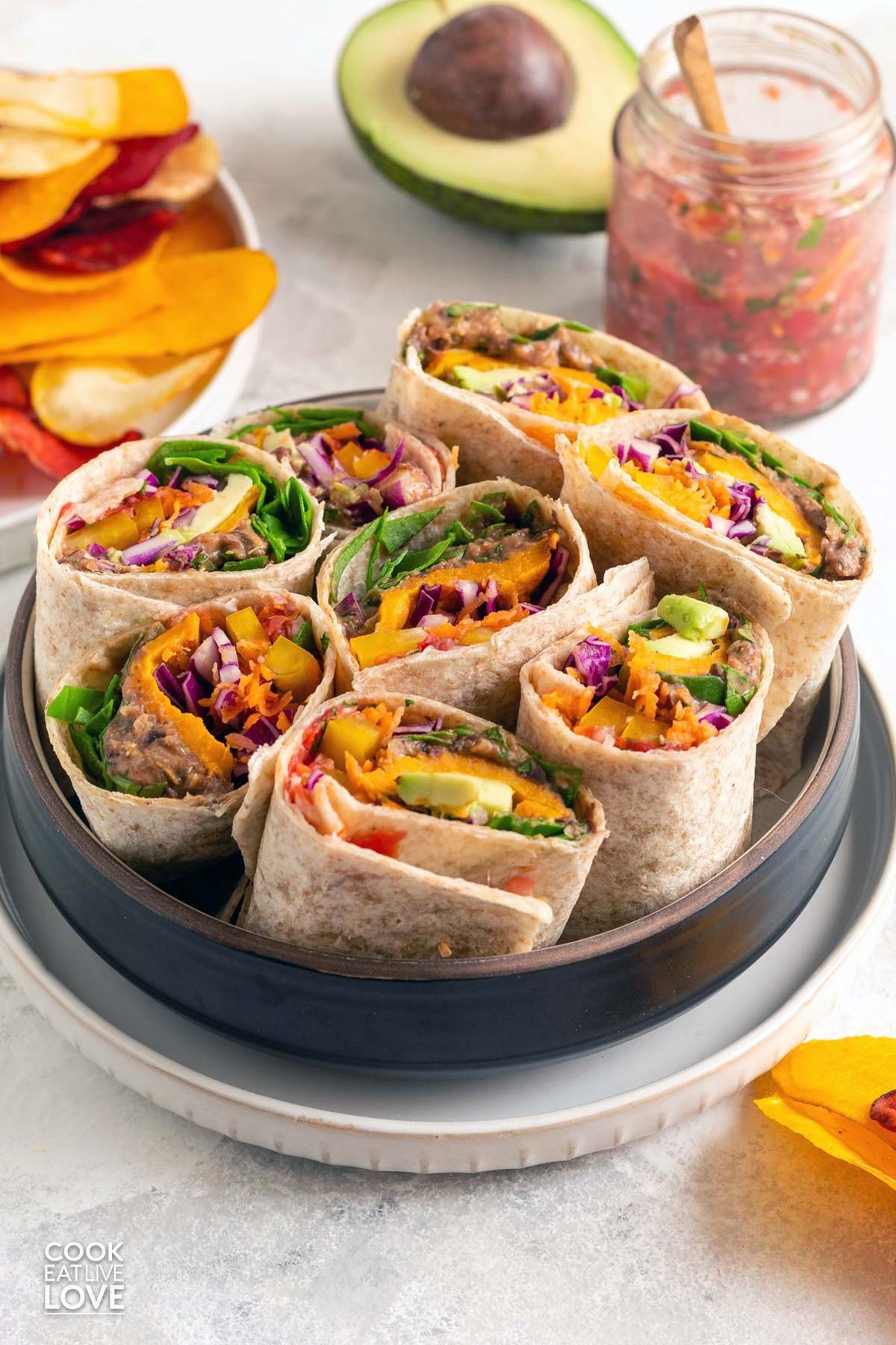 Southwestern veggie wraps on a round tray.