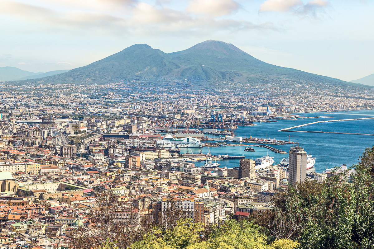 Napoli (Naples) and mount Vesuvius in the background at sunset in a summer day, Italy.