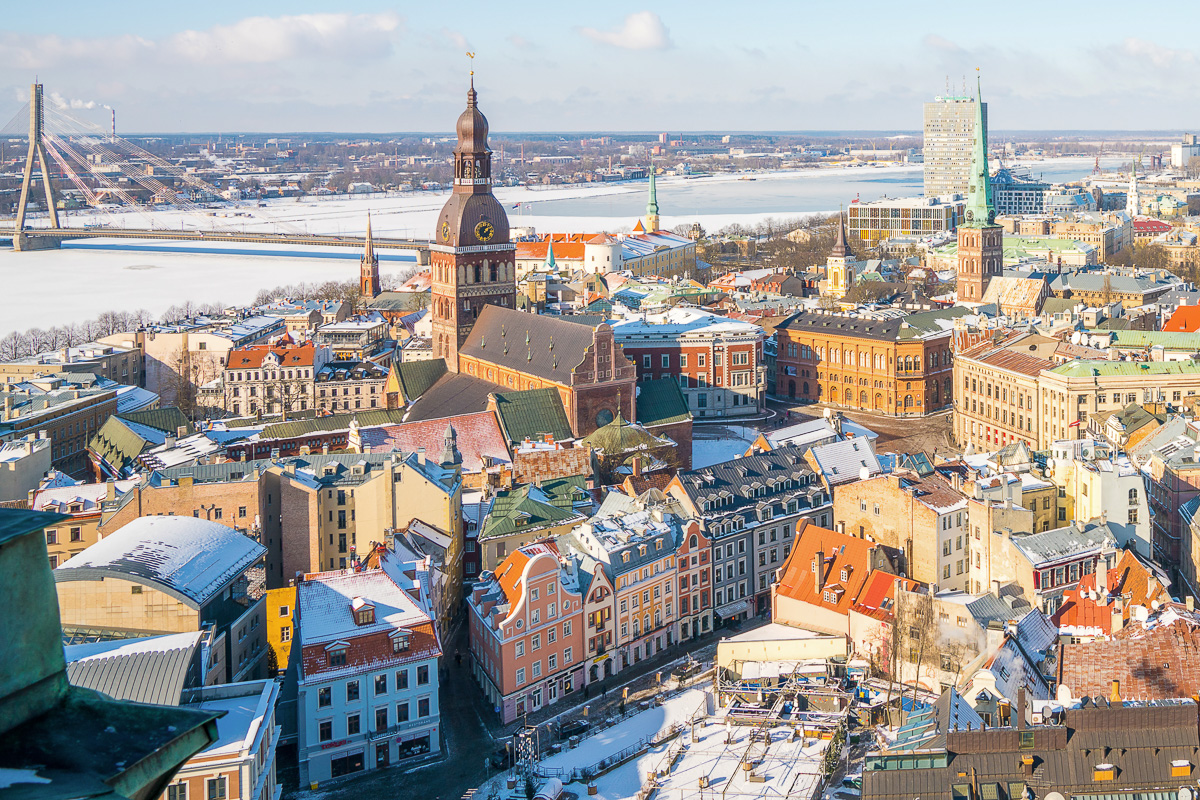 Aerial winter view of the Riga old town from above with a view of river, national library and Dome Cathedral. 