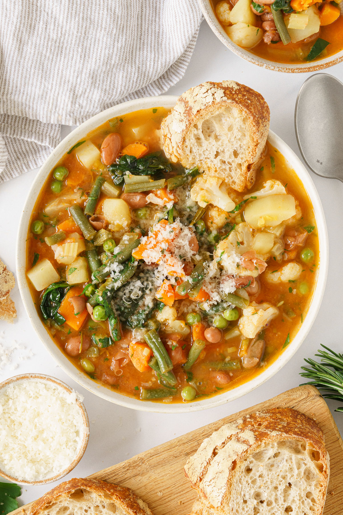 Italian minestrone soup in a bowl with bread.