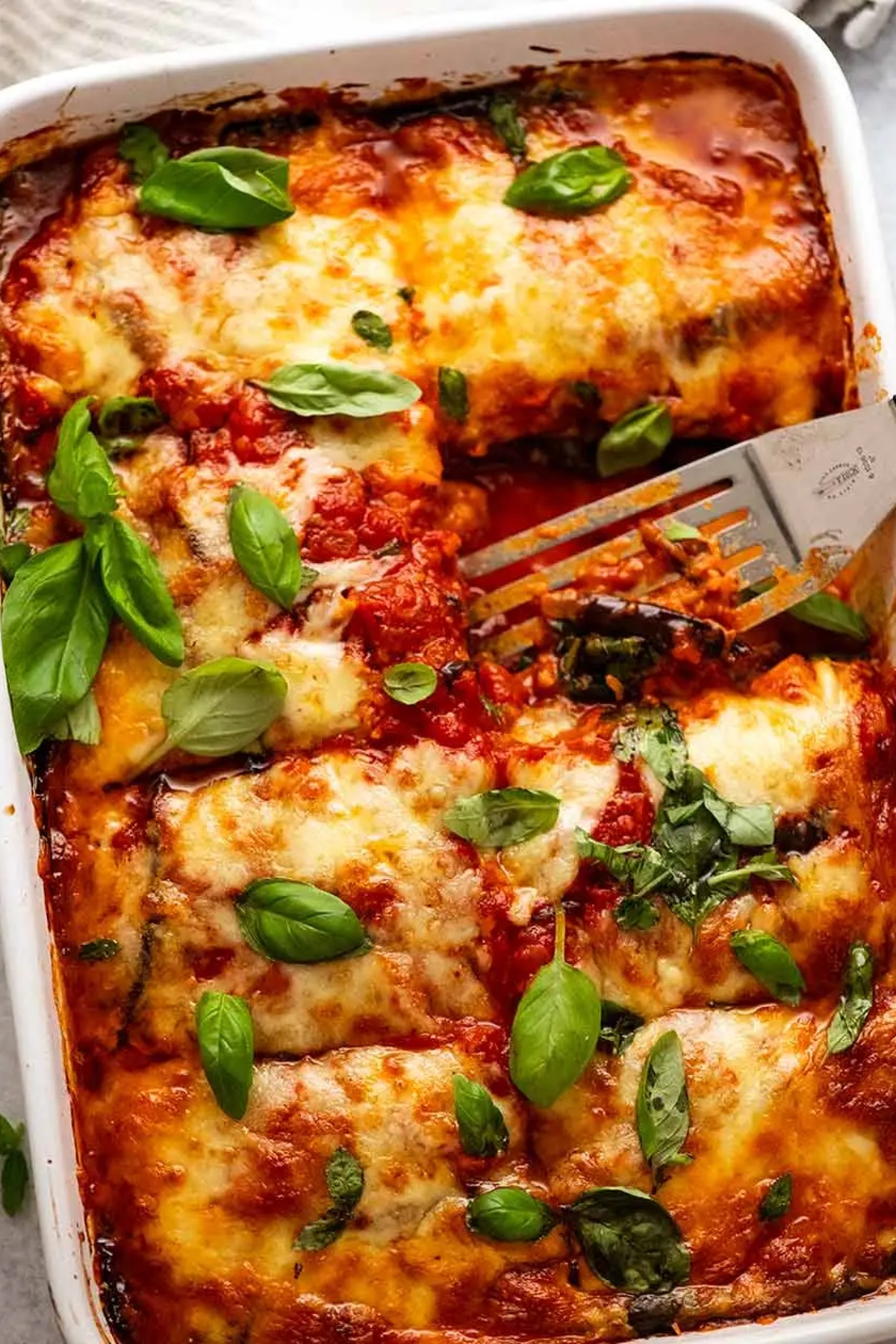 Eggplant parmigiana in a rectangular dish.