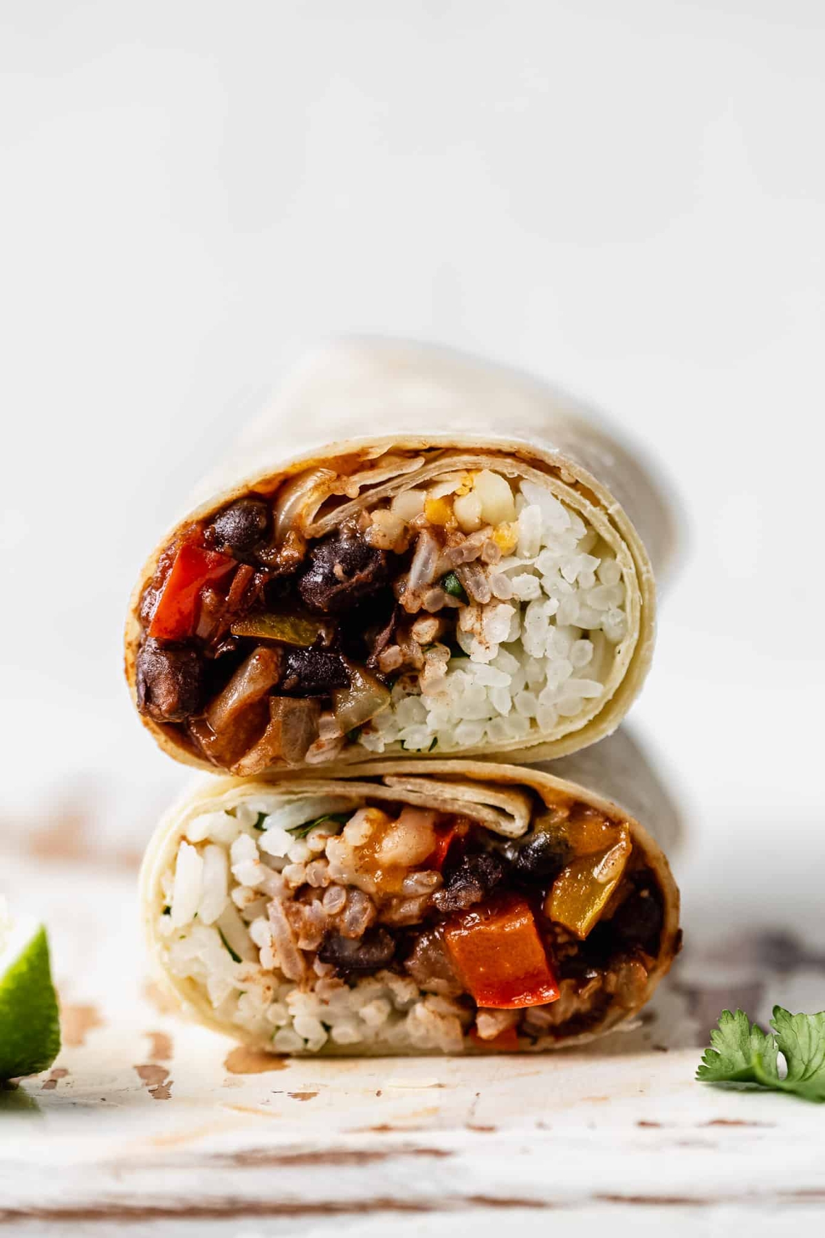 Black bean veggie burritos cut in half.
