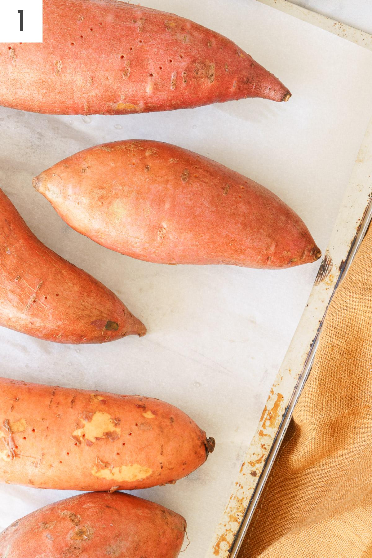 Sweet potatoes on a baking sheet.