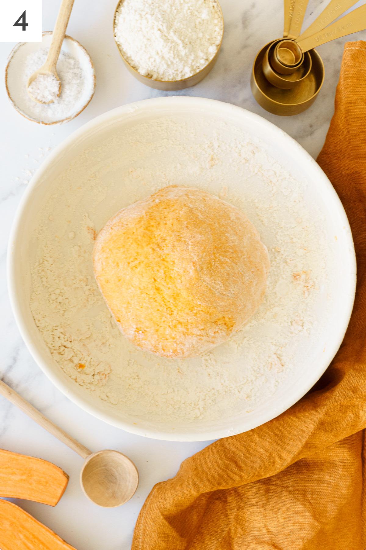 Gnocchi dough on a bowl.