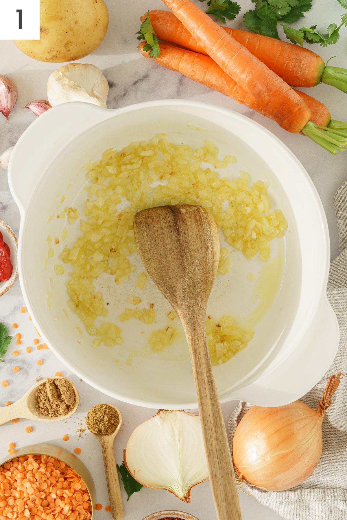 A pot with sauteed onion.