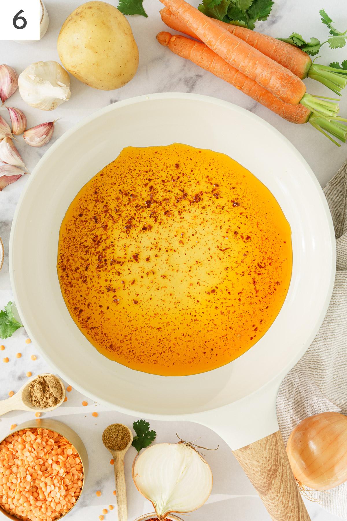 Extra virgin oil with pul biber in a skillet.