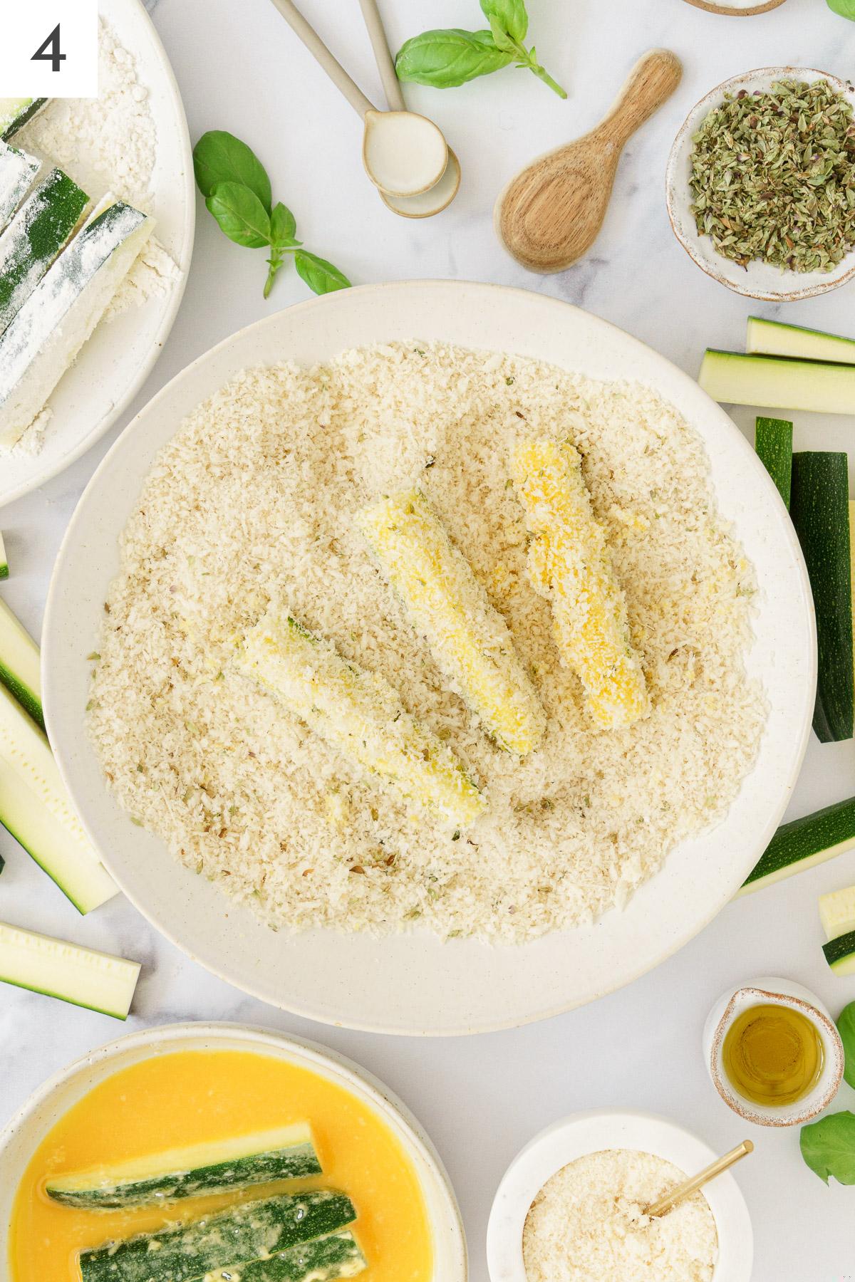 Zucchini sticks rolled in panko-parmesan mixture.